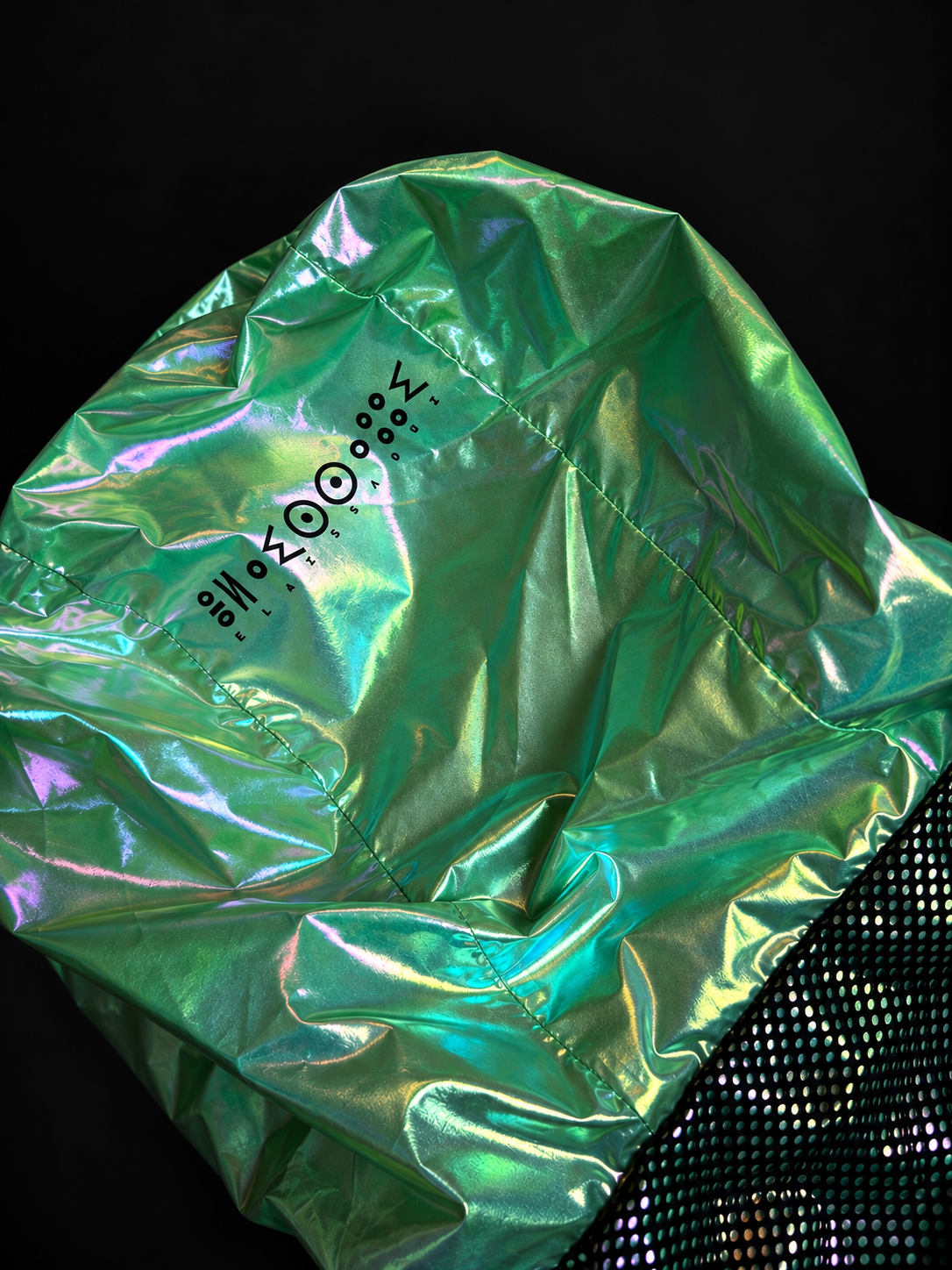 Close-up of the ELAISSAOUI PARA DIZA hood with House marking on the iridescent green surface.