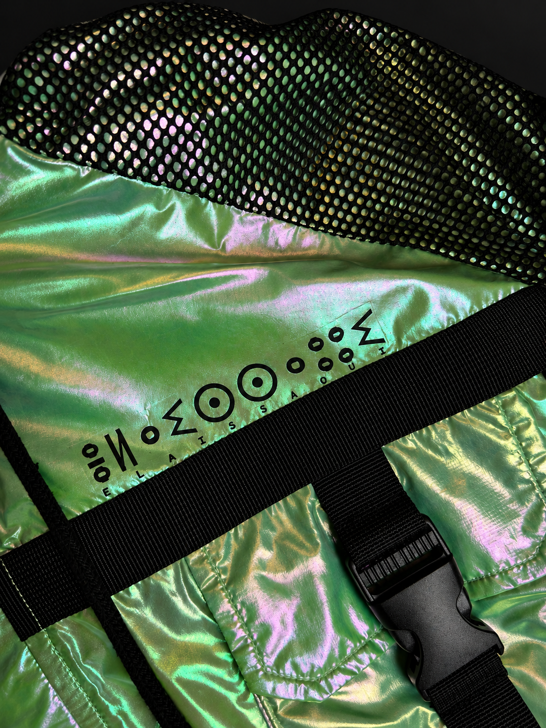 Close-up of the ELAISSAOUI PARA DIZA jacket chest marking, black mesh panel and buckle strap.