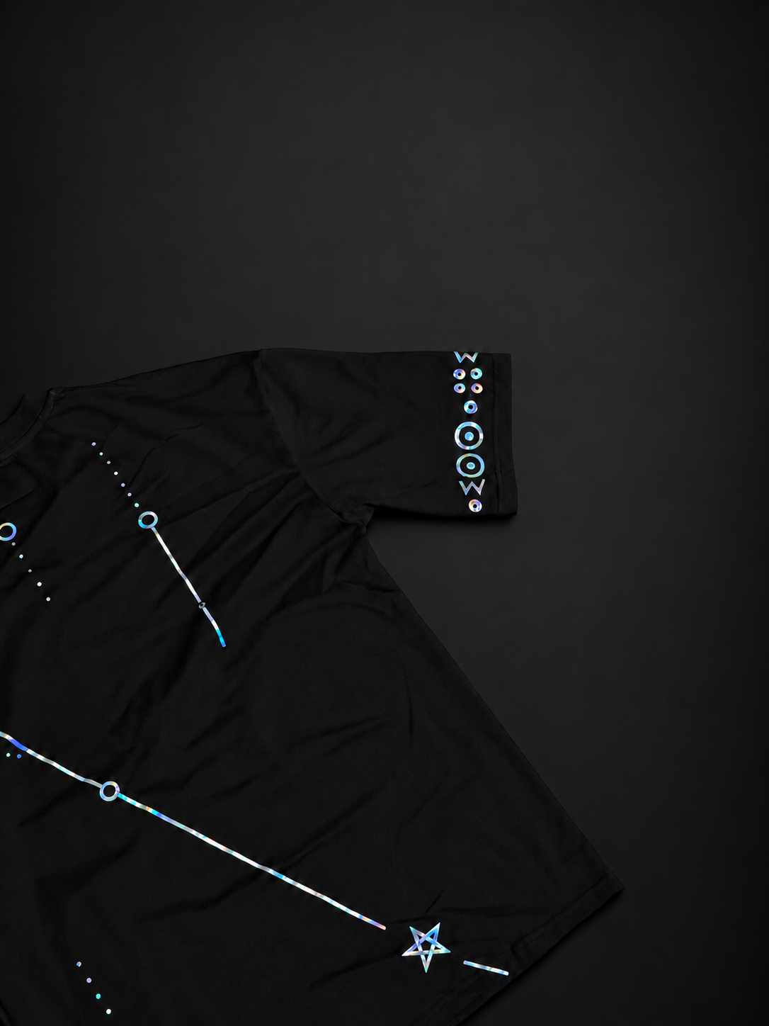 Angled back view of the ELAISSAOUI WLAD AISSA T-shirt showing the sleeve marking and lower star detail.